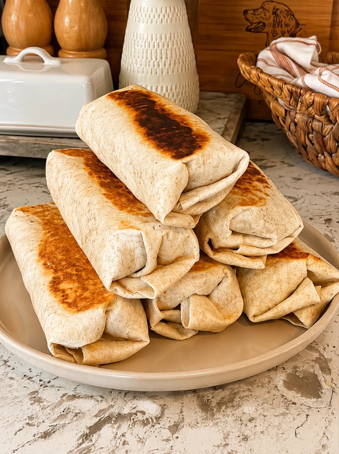 Stack of toasted high protein breakfast burritos