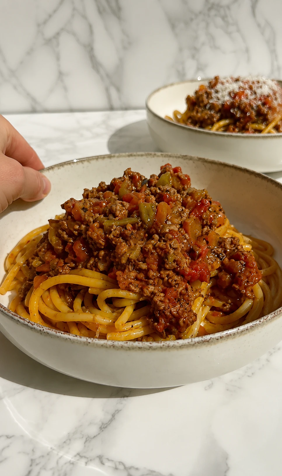 Spaghetti topped with chunky ground beef tomato sauce
