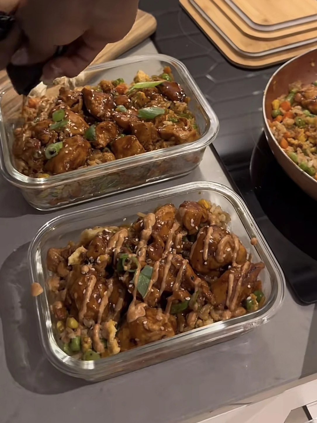 Garlic chicken fried rice meal prep containers with sesame and green onion