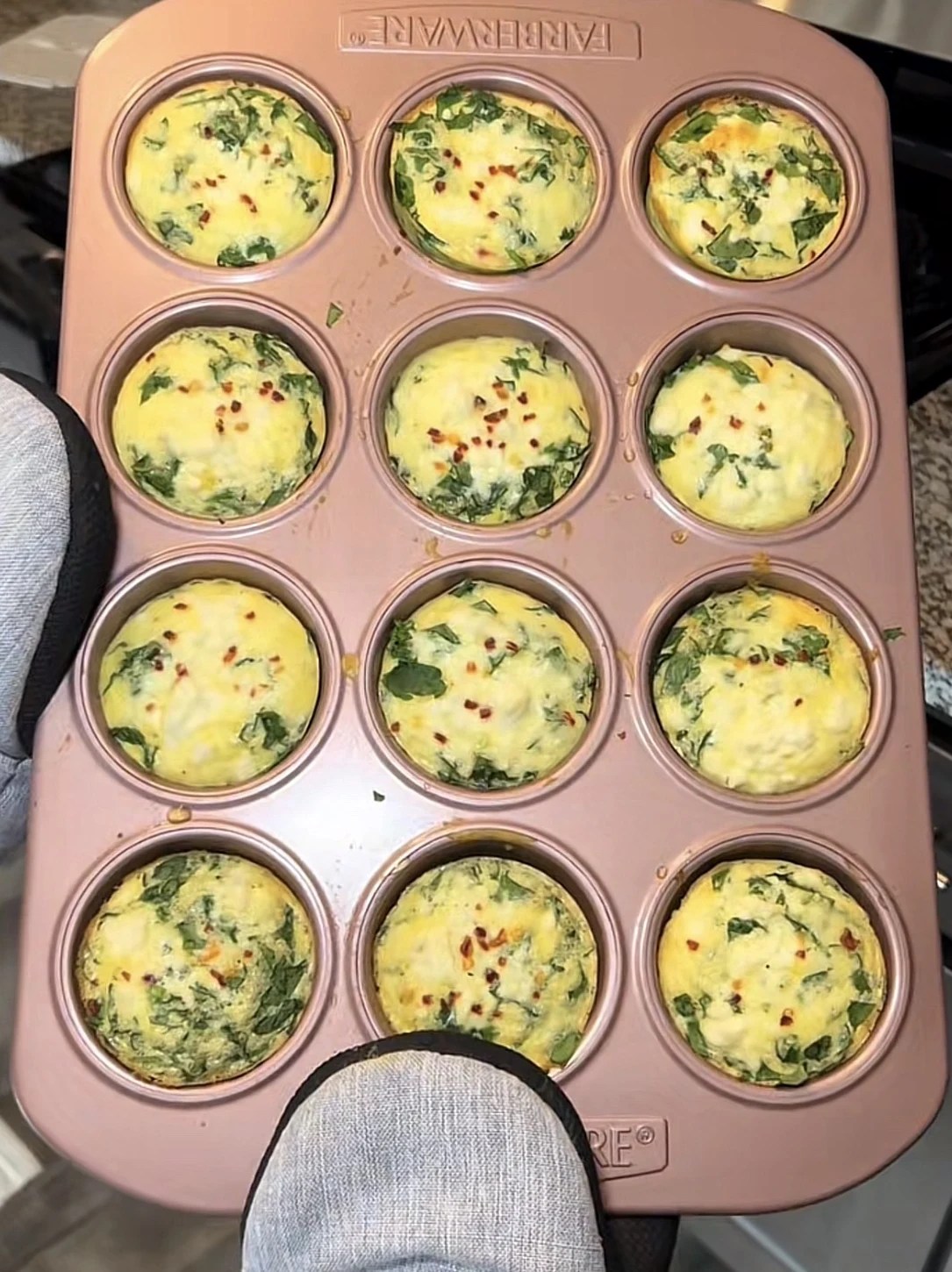 Spinach egg white bites in a muffin tin for college breakfast meal prep